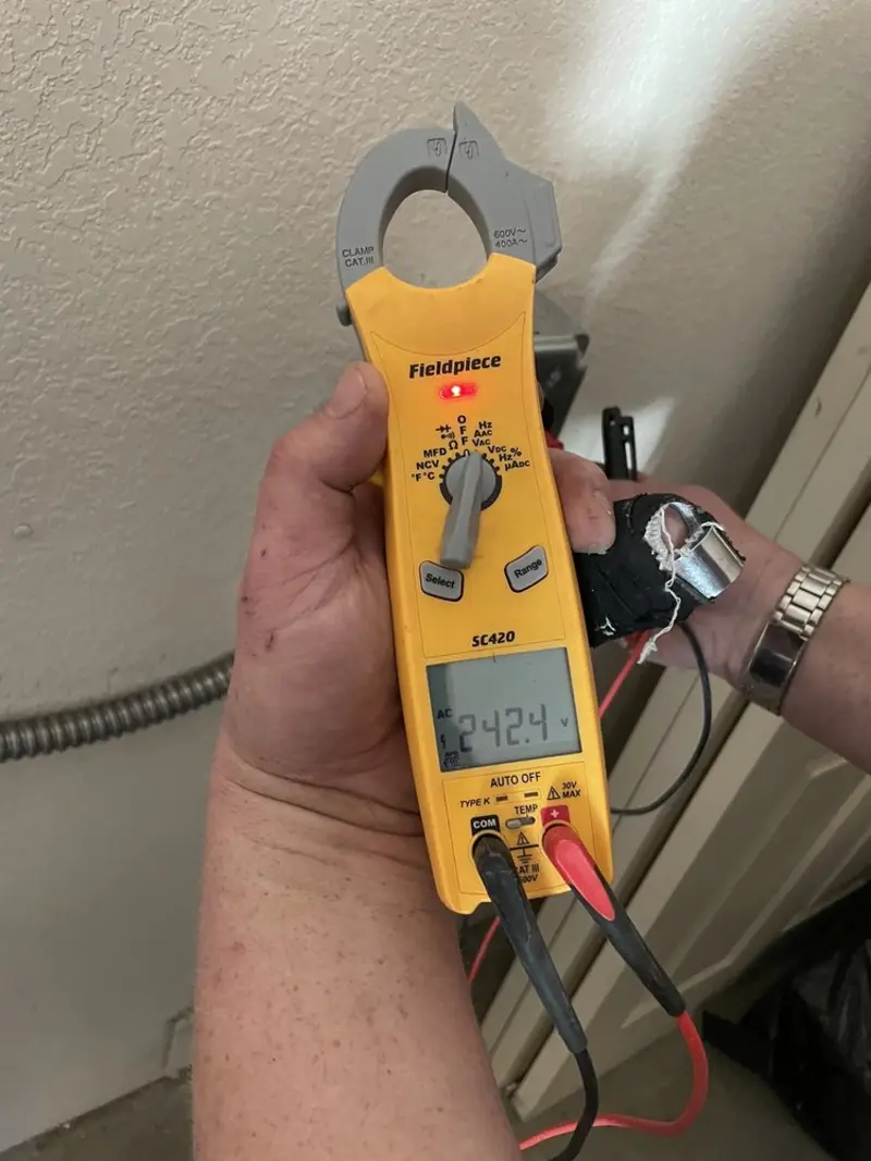 Voltage testing with clamp meter during Whole House Surge Protector in Hartland